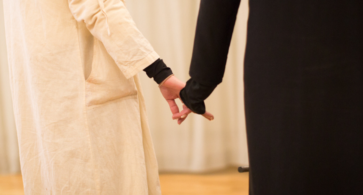 two women holding hands