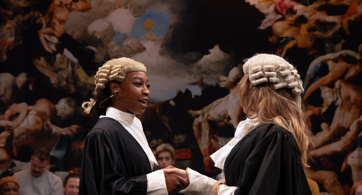 Dominique in The Trials and Passions of Unfamous Women, dressed as a barrister