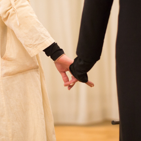 two women holding hands